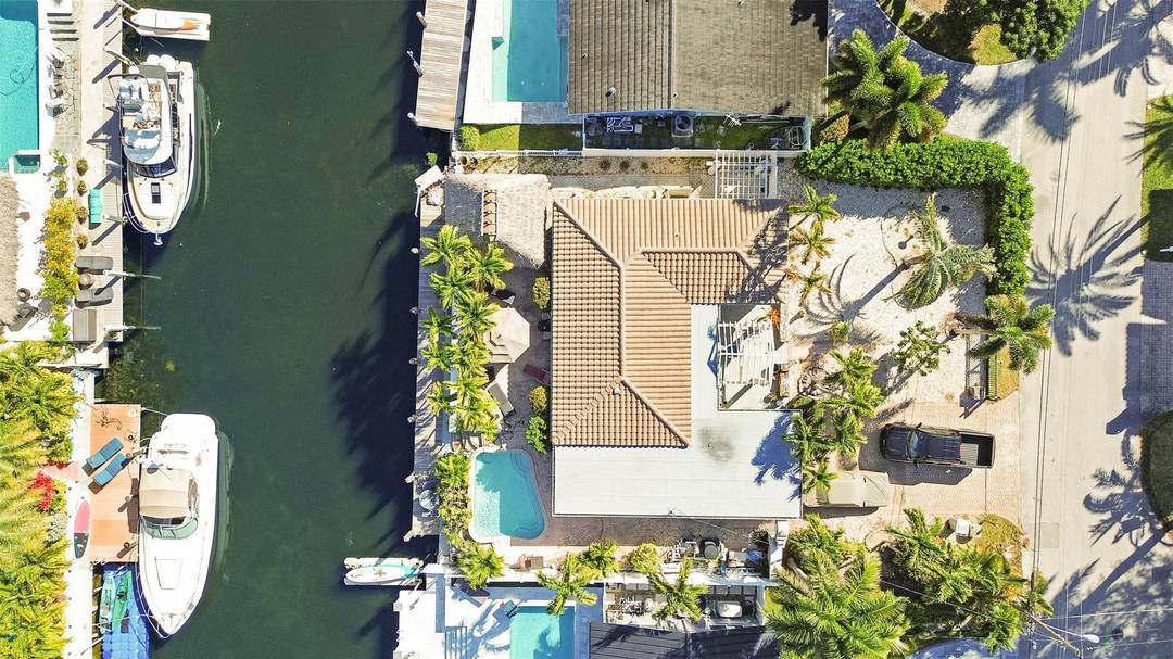 Located in prestigious Pompano Shores, this waterfront pool home offers approximately 75 feet of deep water frontage amp ; no fixed bridges, ideal for serious boaters.