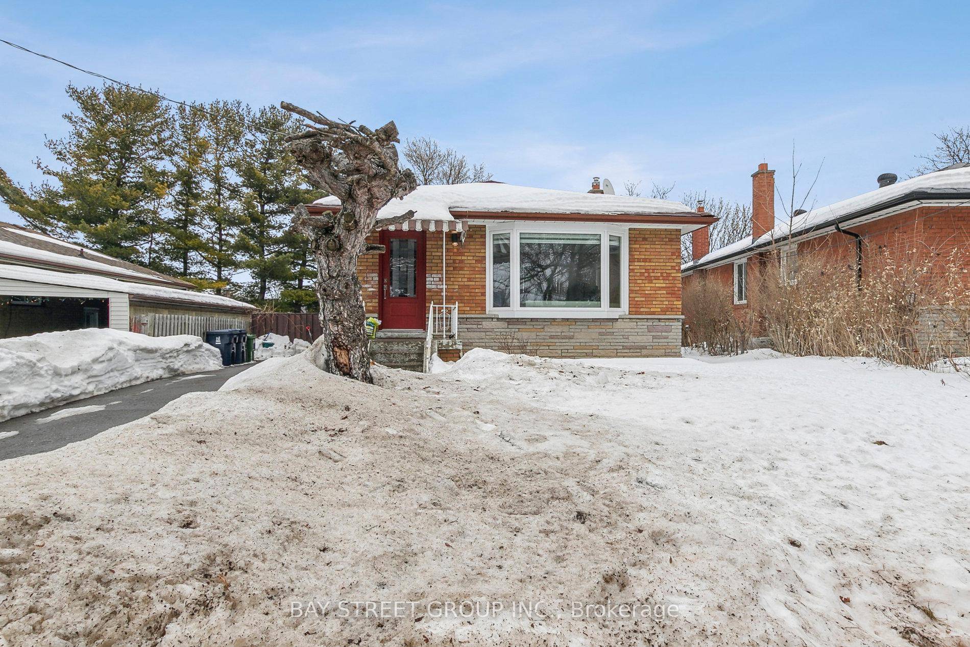 Live in a quiet, luxurious bungalow and let your tenants help pay your mortgage with two basement apartments !