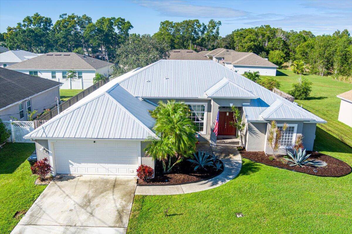 Beautifully designed 4 2 2 CBS POOL HOME with NEWER METAL ROOF water heater 2020, summer kitchen, new fence pavers.