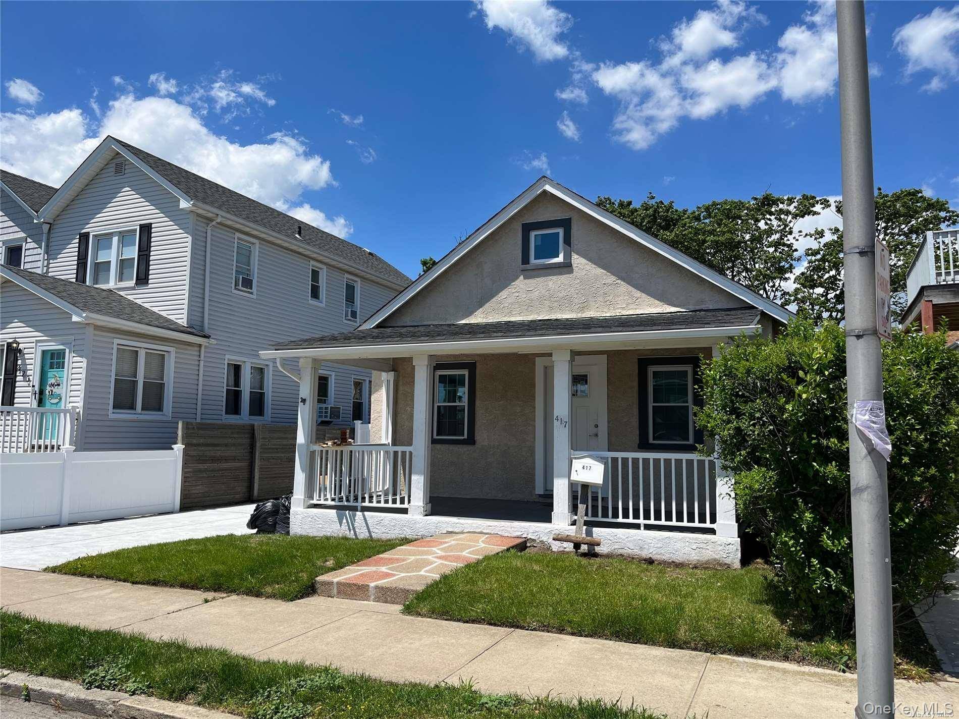 Cozy Cottage in the Westholme area with large paved driveway, covered front porch and back yard.