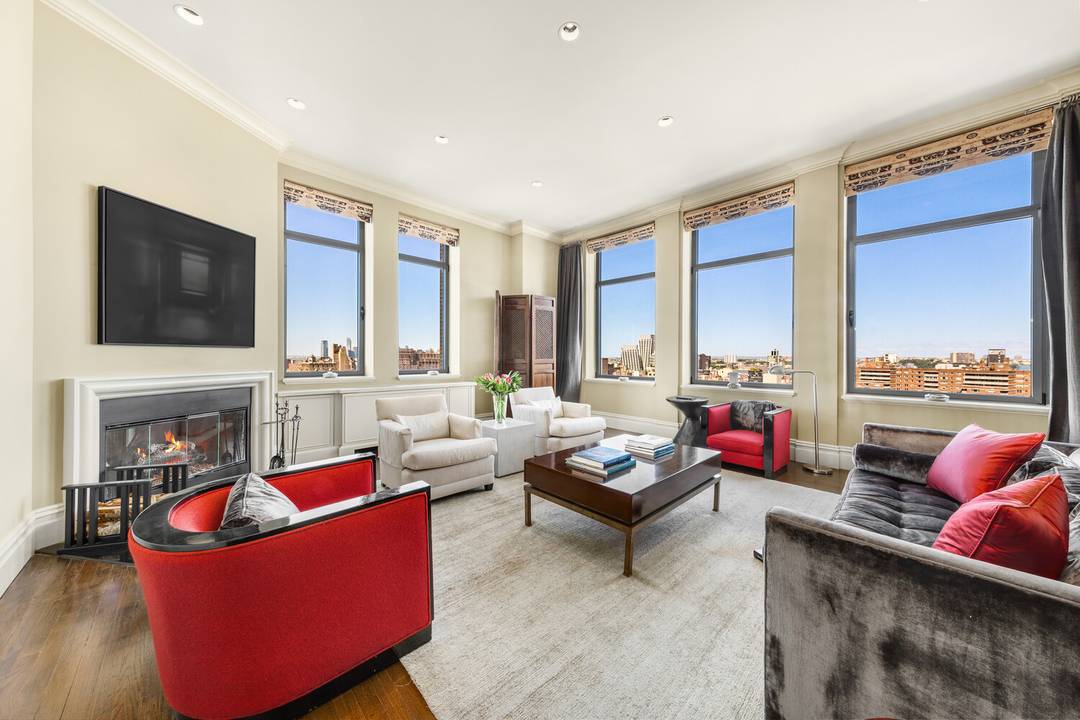 This duplex penthouse residence feels like a townhouse in the sky, with a gracious entry hall leading to the living dining space, kitchen and two bedrooms on the first floor.