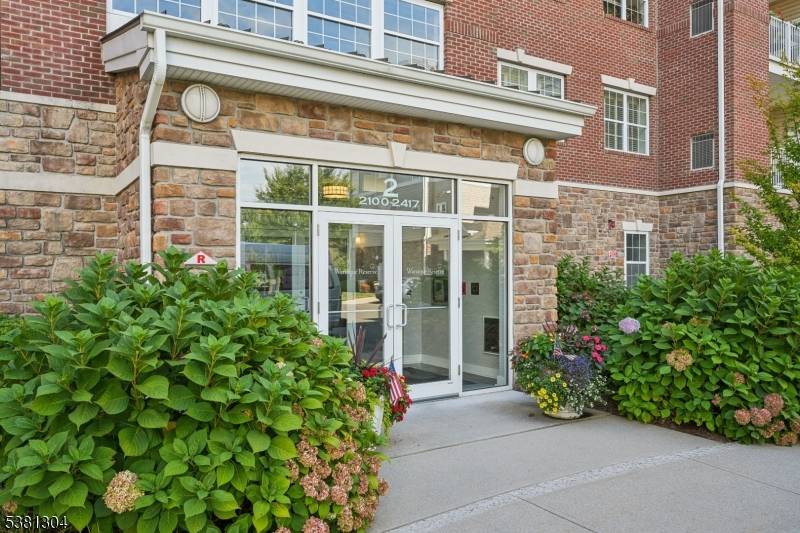 Welcome to this beautiful Colfax END UNIT condo in the highly desirable Wanaque Reserve, an active adult 55 community.