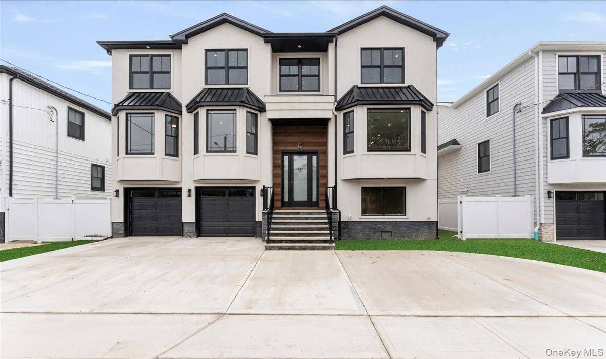 Welcome to 917 Greenfield Rd, a stunning new construction in the prestigious Academy Area of Woodmere.