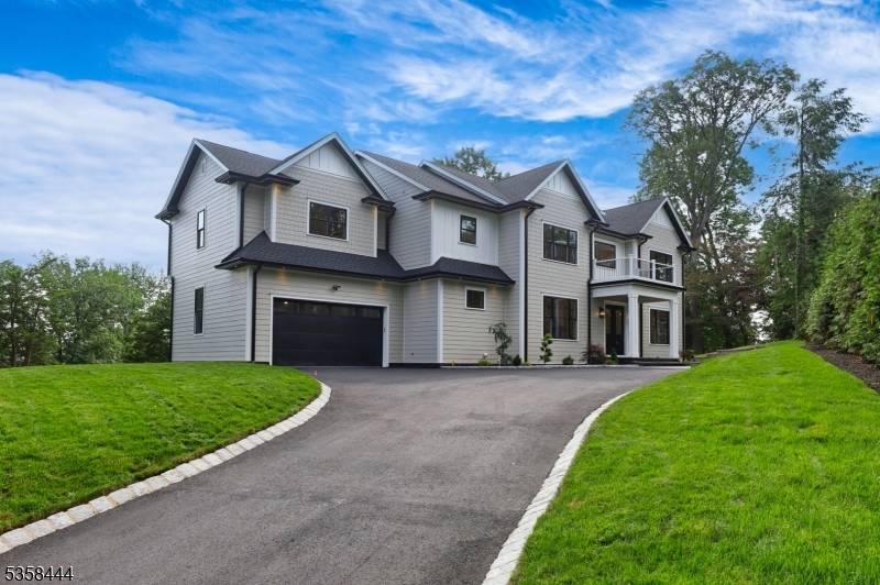 Exceptional New Construction with Custom Finishes and Private Setting.