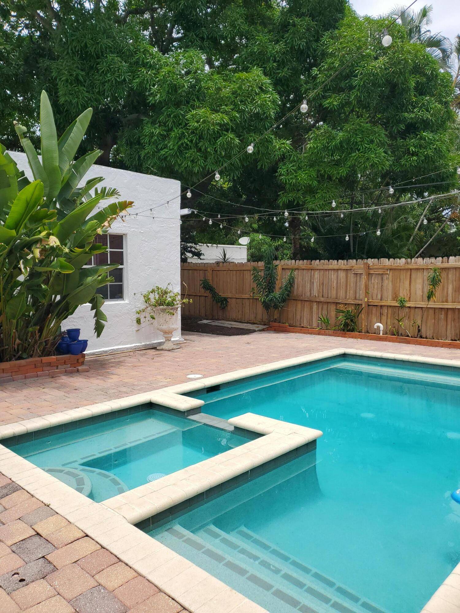 Nestled in the historic Old Northwood district of West Palm Beach, this charming home offers a perfect blend of vintage beauty and character.