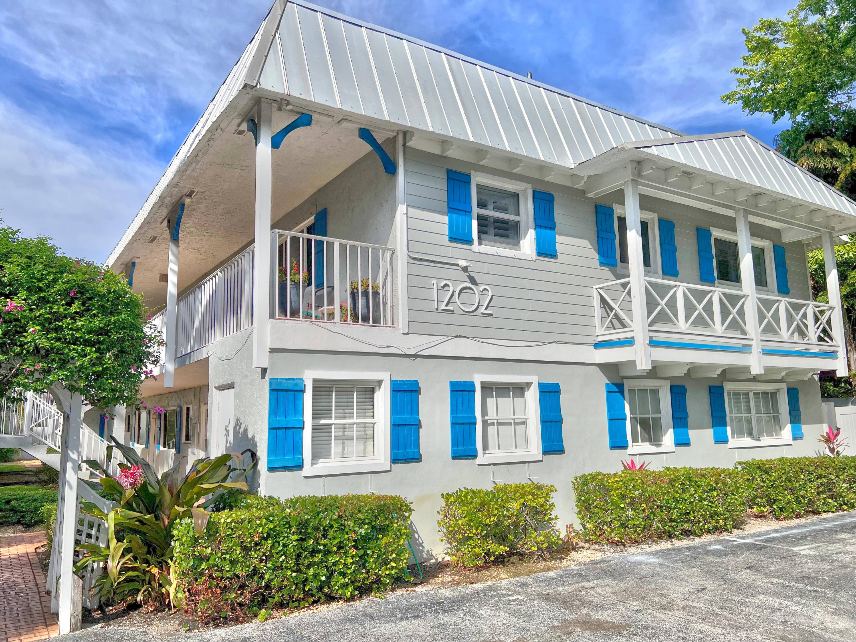 Nestled among luxury homes on a quiet street, East of Route 1, you will find 1202 Palm Trail, a Key West style charming community.