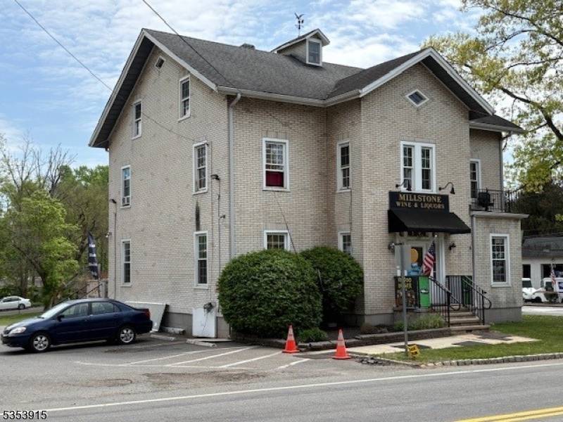 UNBELIEVABLE 2 UNIT FREE STANDING MIXED USE PROPERTY ON A CORNER LOT WITH AMPLE PARKING.