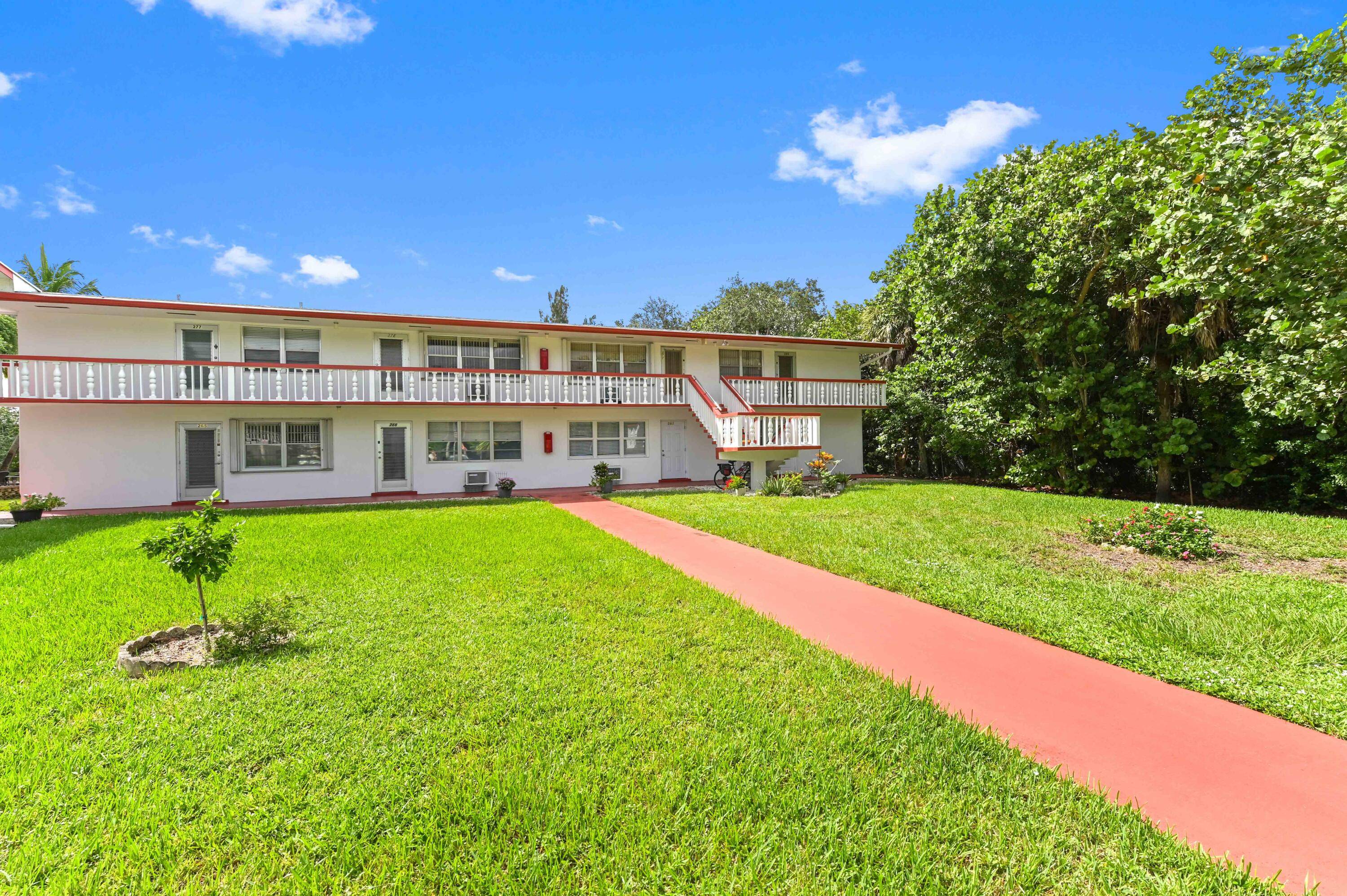 Welcome to this first floor corner unit that features a bright and cozy living space with neutral tile flooring, leading seamlessly into the main areas.