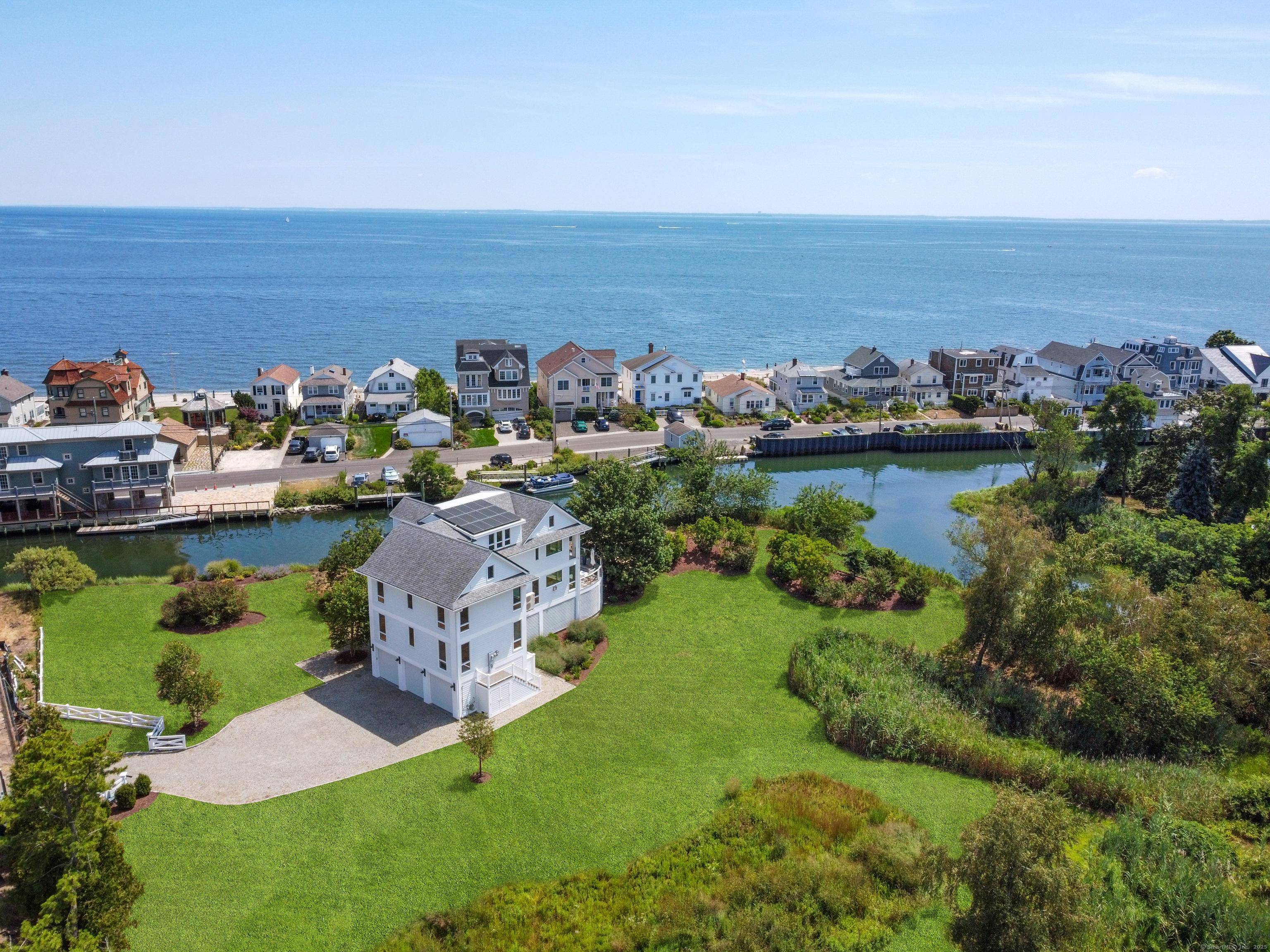 Extraordinary waterfront sanctuary offering unmatched privacy and expansive 1.