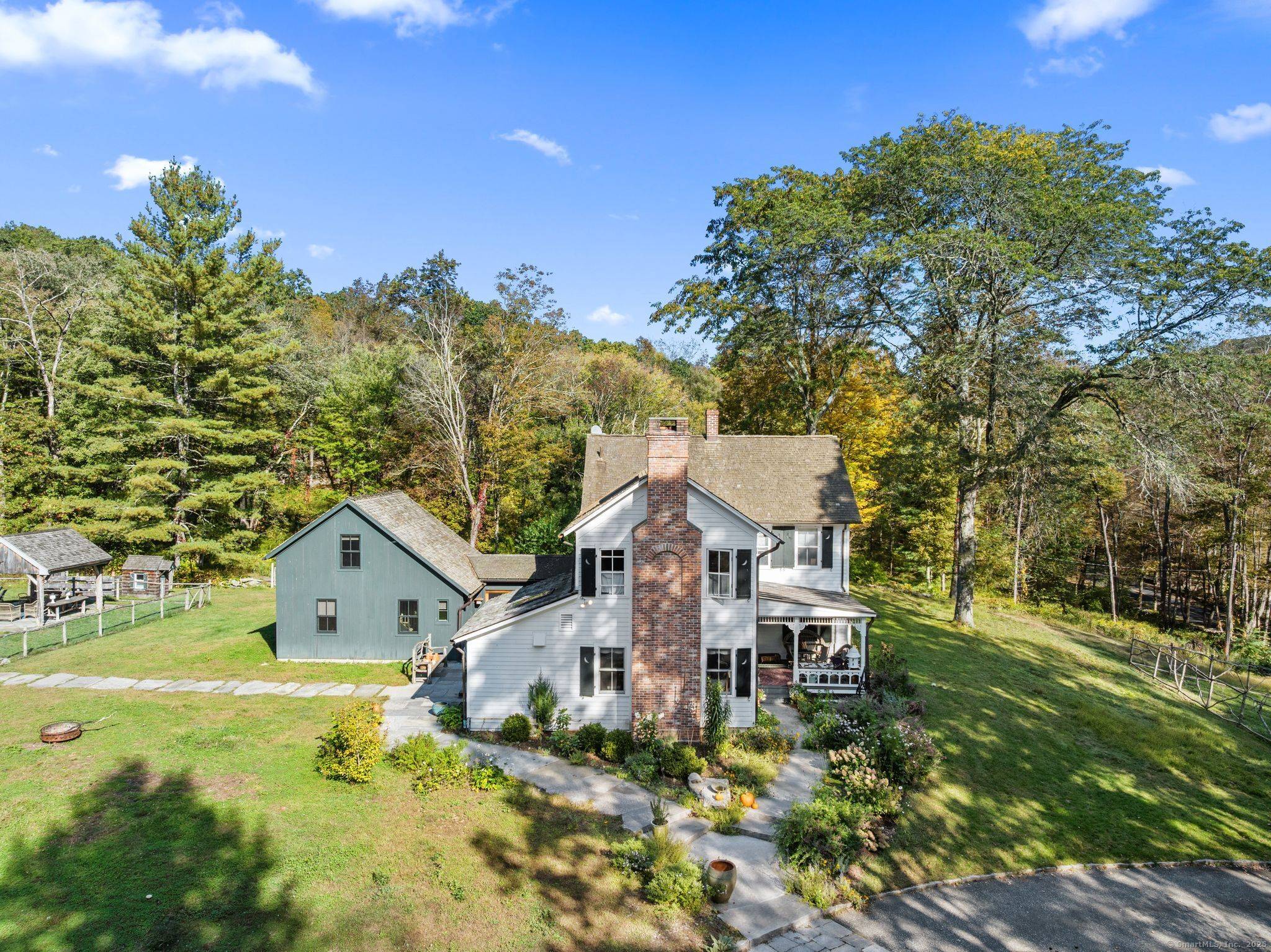 A distinguished equestrian estate of rare beauty, this property unites timeless New England architecture with the serenity of country living.