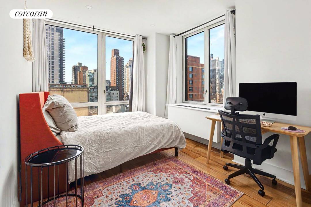 This bright and well appointed three bedroom, two bathroom residence at Bridge Tower Place is move in ready and thoughtfully updated throughout.