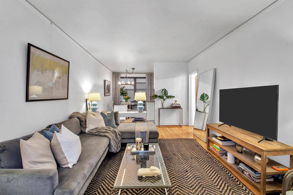Step into a stunning wallpapered foyer featuring two generous closets, setting the tone for this thoughtfully designed home.