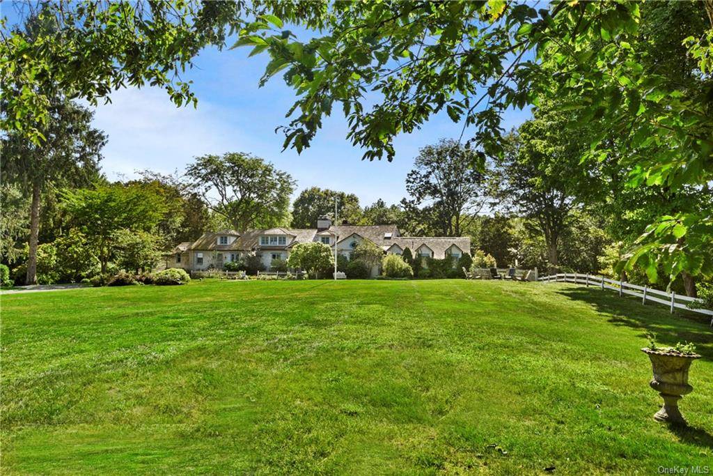 Gracefully sited on almost 10 acres of pastoral property with pool, tennis and amazing gardens.