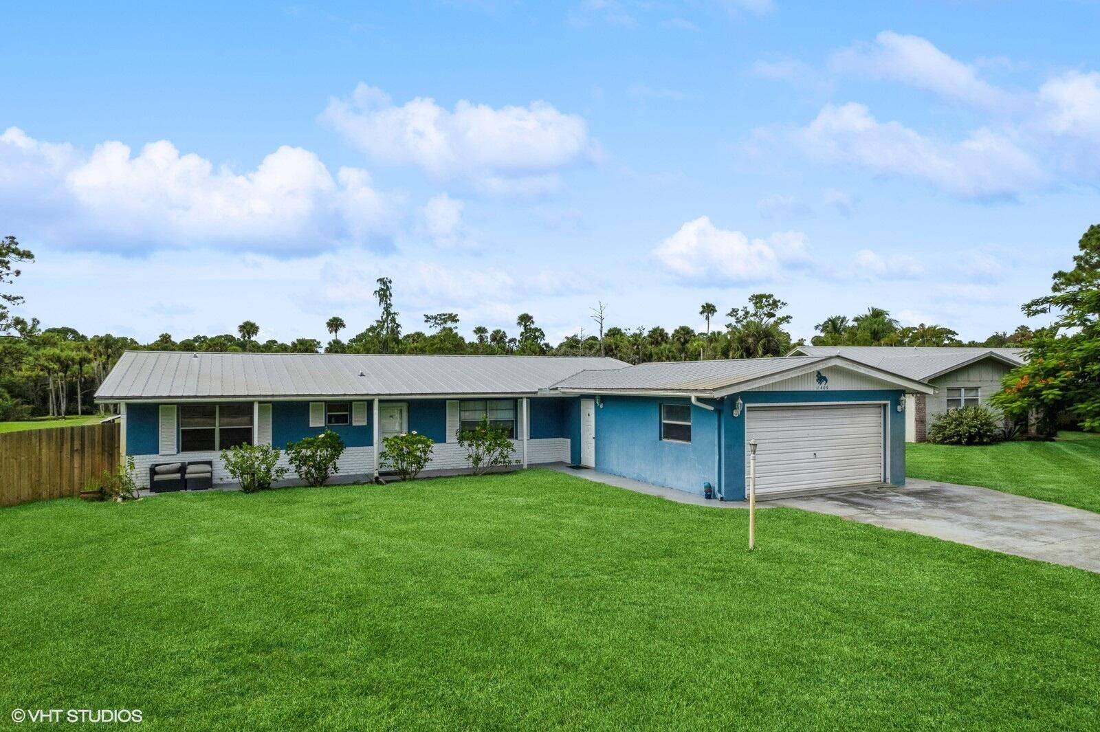 3 bedroom 2 and 1 2 bath pool home fixer upper with 2 car garage in Palm City off Mapp Road, south of Martin Hwy.