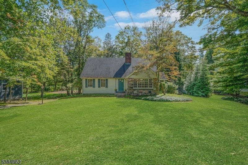 Welcome to this storybook 4 bedroom, 2 bath Cape Cod nestled on a level lot in the quaint Brookside section of Mendham Township.