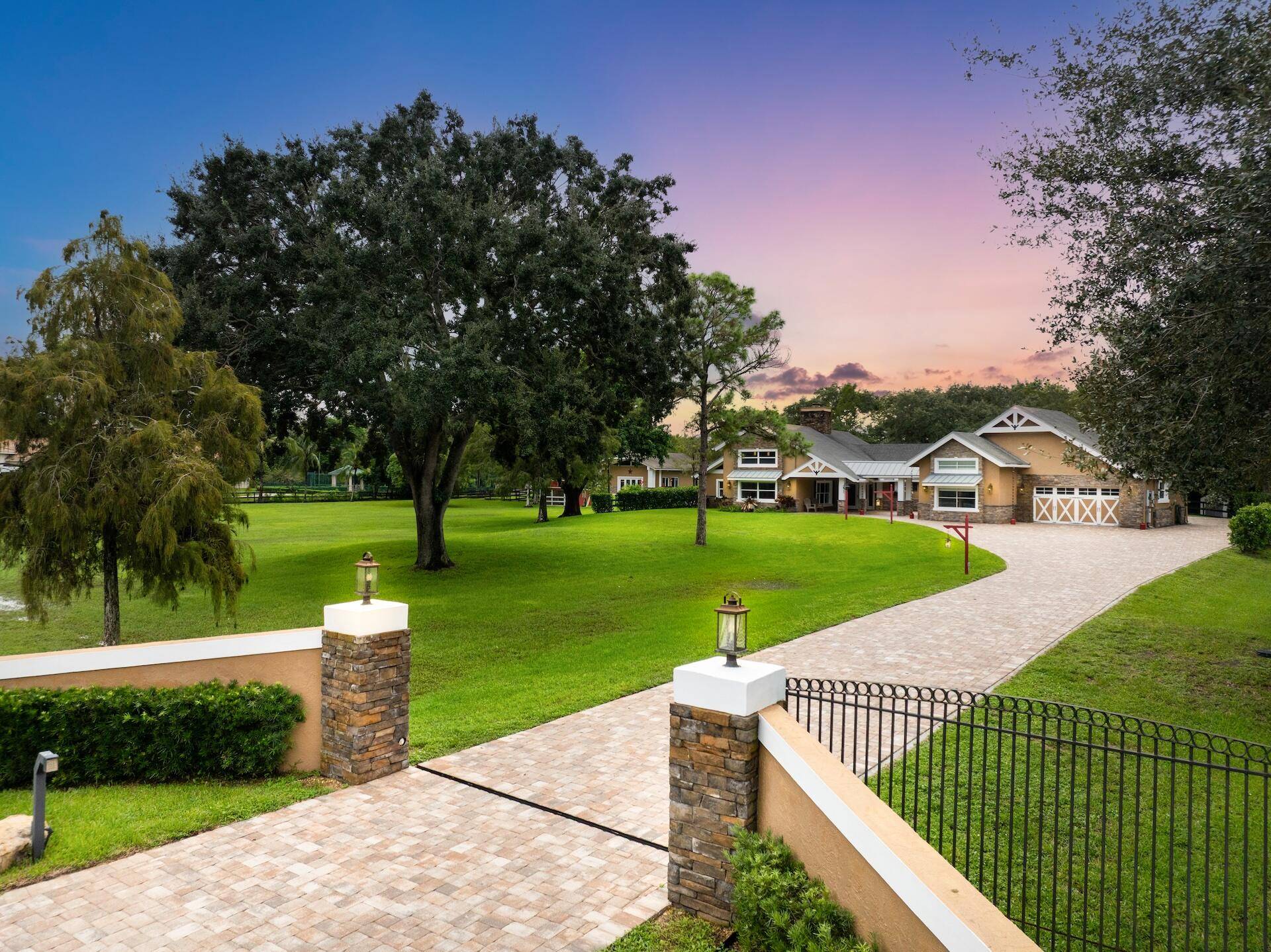 Experience true serenity in this custom, country chic, pristine estate on 3 well manicured acres in Parkland Ranches.