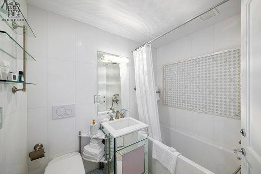 Beautifully renovated two bedroom two bath facing south with terrific Manhattan Skyline views and a private 20x20 terrace.