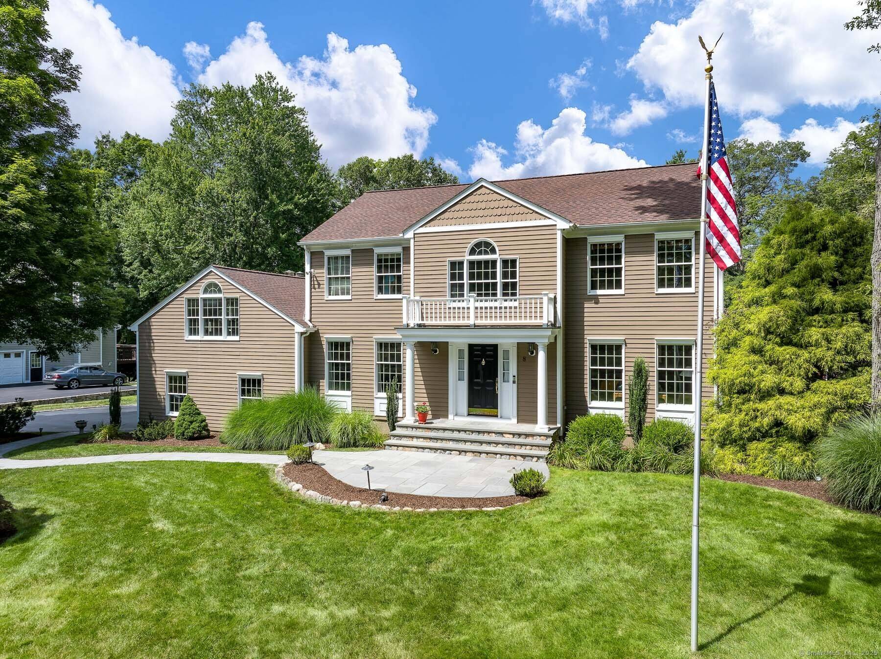 Welcome to 8 Leeds Lane, one of just six homes on a private cul de sac in Darien.