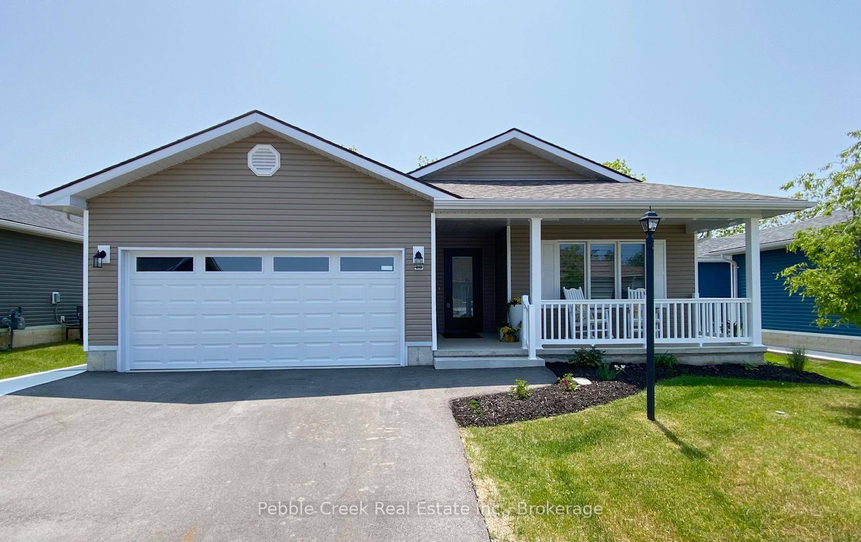 Spectacular ! This beautiful home is situated on a premium outside lot in The Bluffs at Huron !