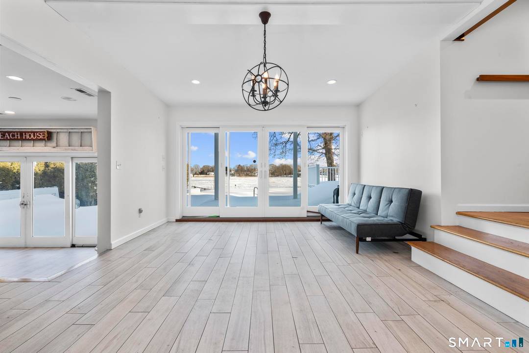Wake up to sweeping shoreline views in this stunning 3 bedroom, 3 bath beachfront home in the heart of Branford, Connecticut.