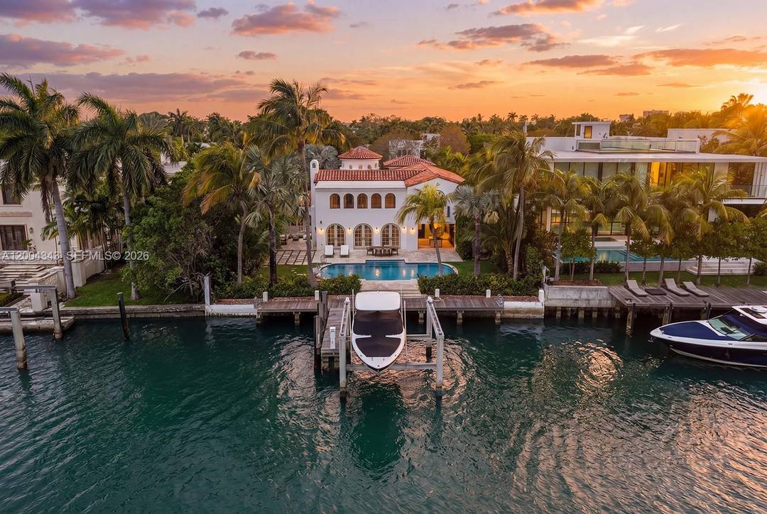 Behind a gated entrance on coveted Pine Tree Drive, this beautifully renovated waterfront retreat unfolds as a private sanctuary on a 12, 920 SF lot with 76 feet of water ...