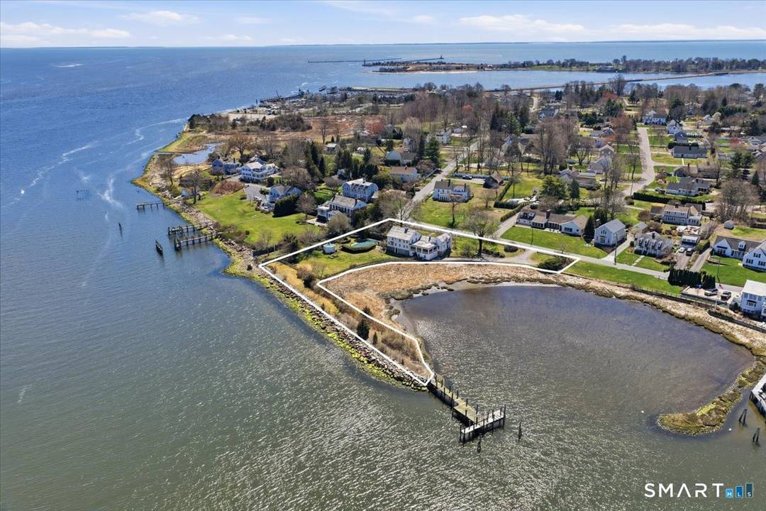 An exceptional offering in the heart of North Cove, this storied estate presents a rare convergence of history, scale, and coastal prestige in Old Saybrook.