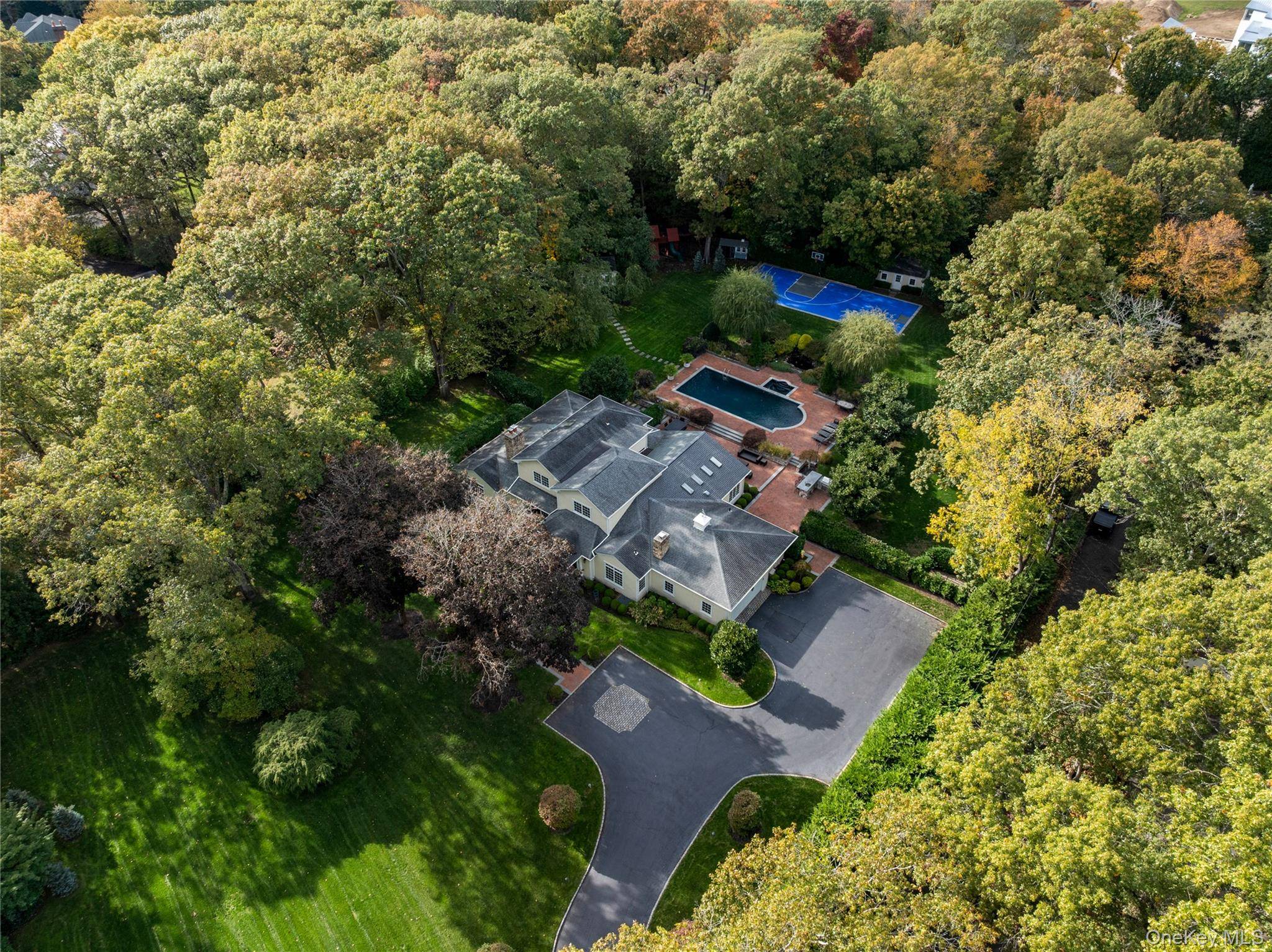 Set behind a private drive on one of Long Island s most prestigious streets, this stunning, newly constructed, Expanded Ranch rests on a meticulously landscaped two acre property within the ...
