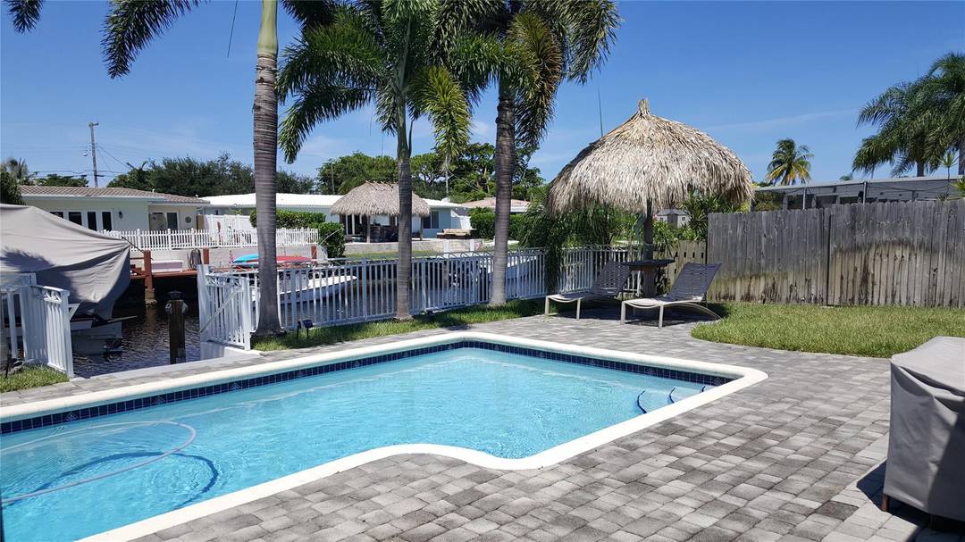 Enjoy direct waterfront living in this beautifully maintained 3 bedroom, 2 bath home with pool, located on a quiet street with excellent access through two fixed bridges.