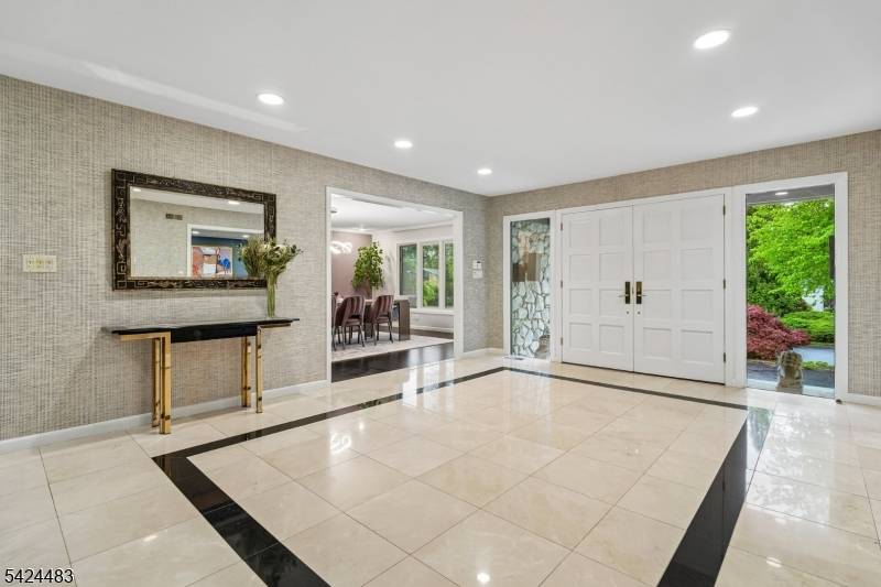Located in the prestigious Deerfield section, this sprawling 5 BR, 4.