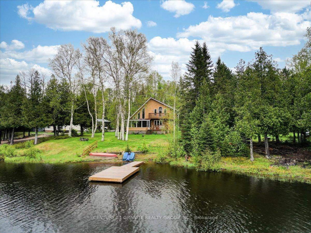 Welcome to 81 Macrae Lane, a captivating four season waterfront home tucked along the tranquil shores of Graphite Lake.