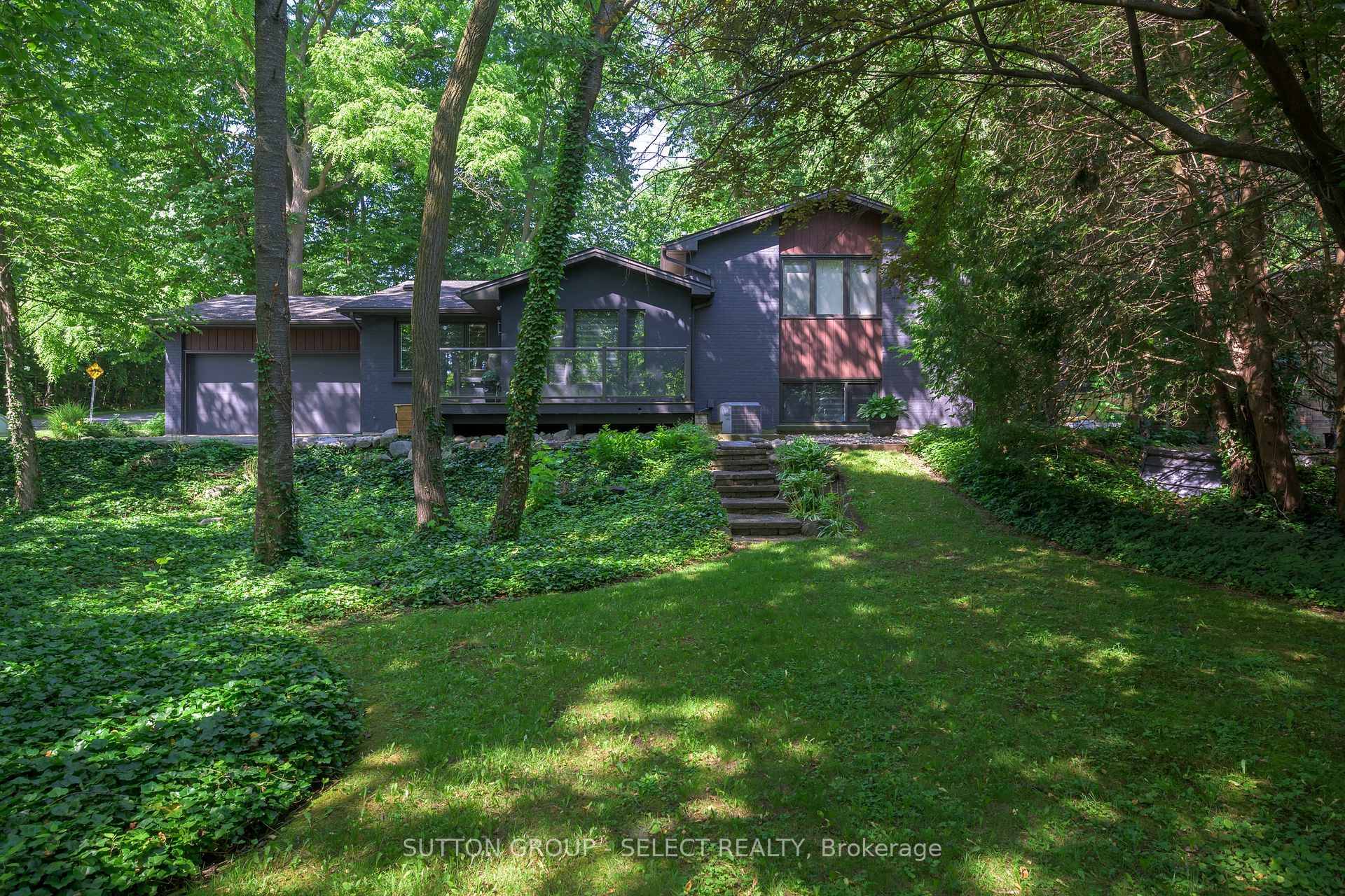 Stunning lot, over 1 3 acre, full and lush with soaring trees amp ; trailing gardens.