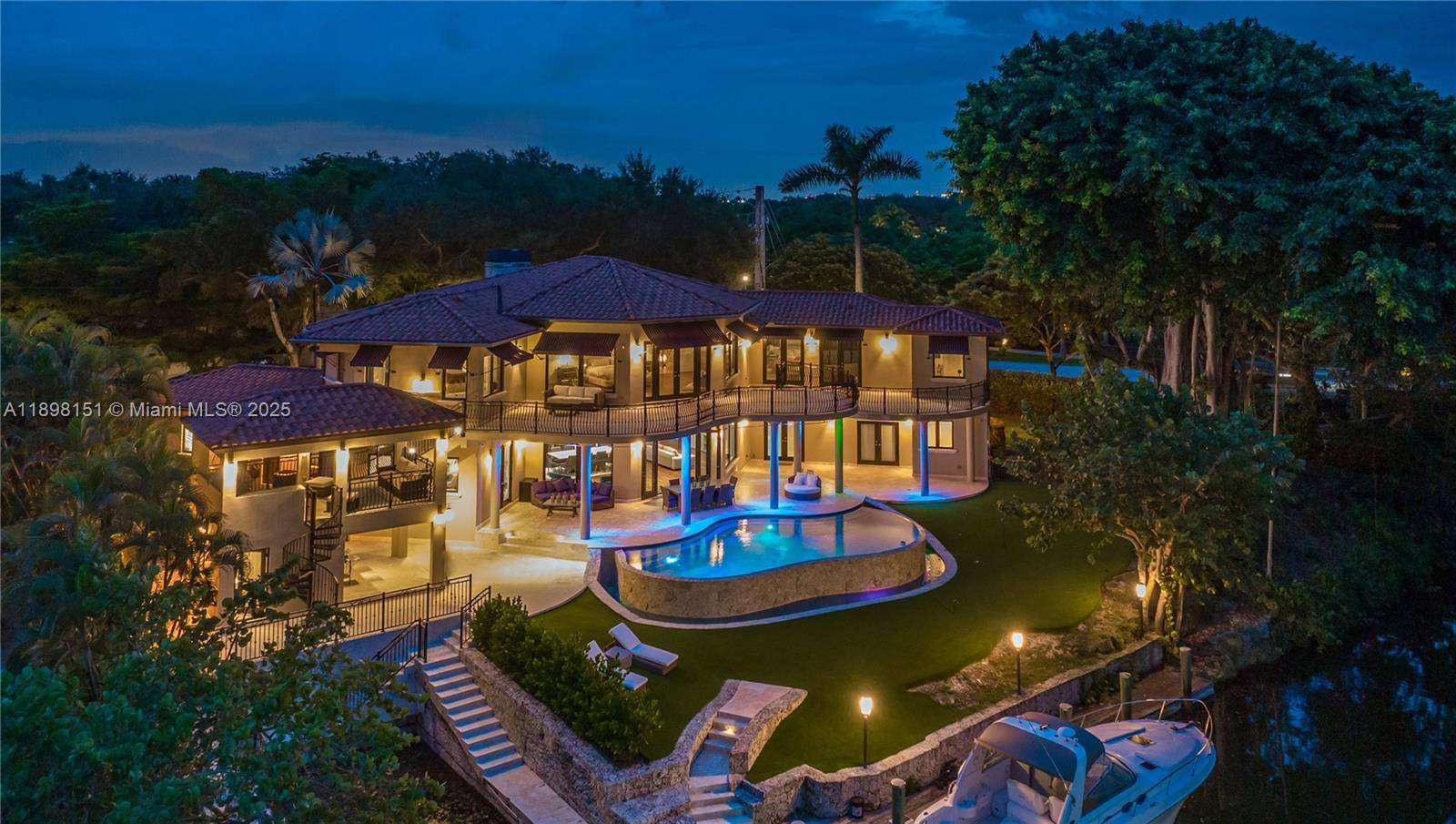 Discover an exceptional double corner lot estate on the peaceful Mahi Waterway in South Coral Gables.