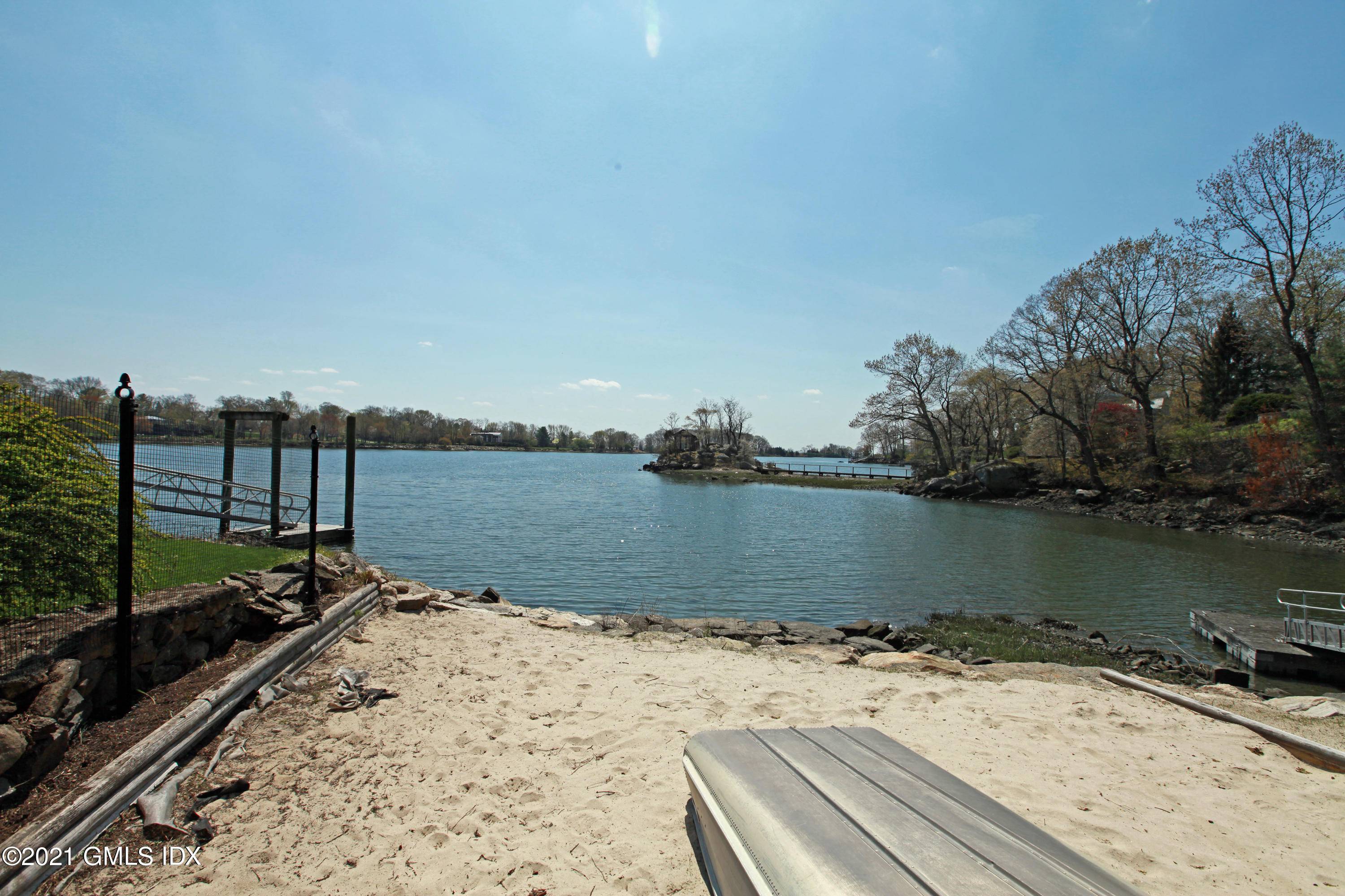 SUMMER RENTAL Waterfront with its own private sandy beach within the private gated Indian Harbor Association with 24 hour security.