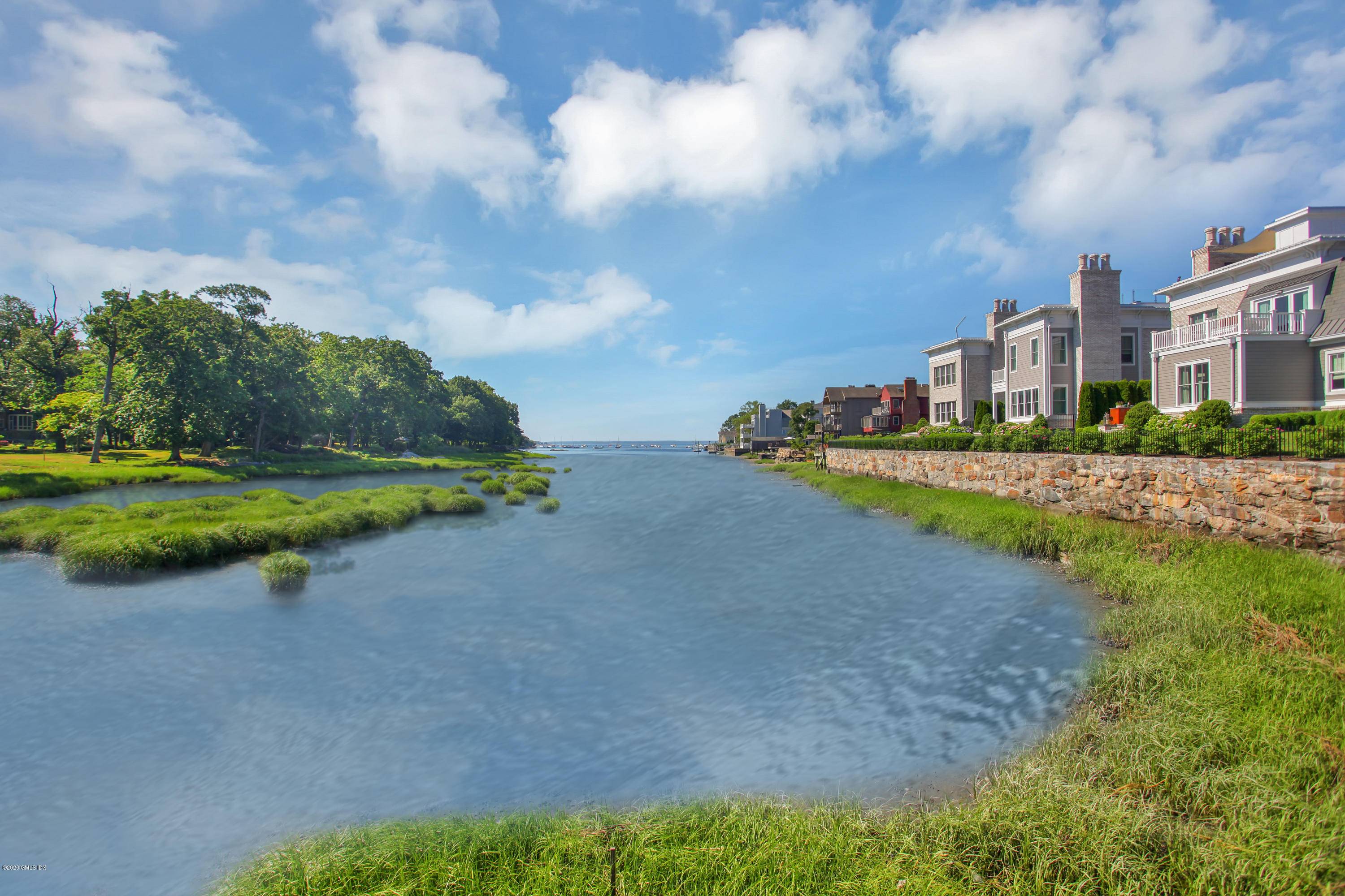 A rare opportunity to own an amazing, central Greenwich townhouse, overlooking Smith Cove !