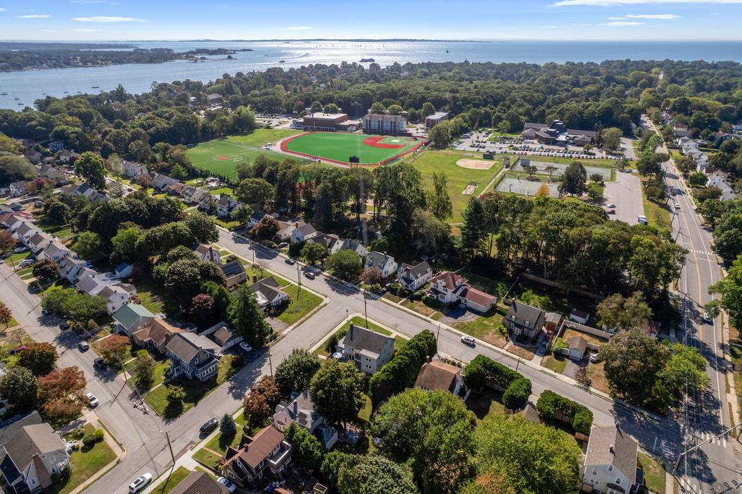 Stunning light filled home seamlessly blends modern conveniences with timeless charm on a desirable level corner lot.