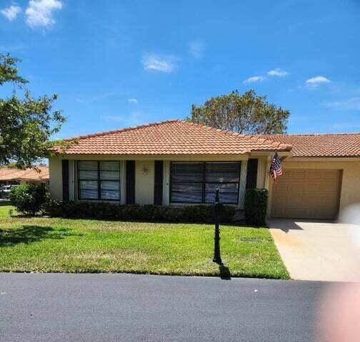 This charming villa offers exceptional privacy on an oversized corner lot with no rear neighbors.