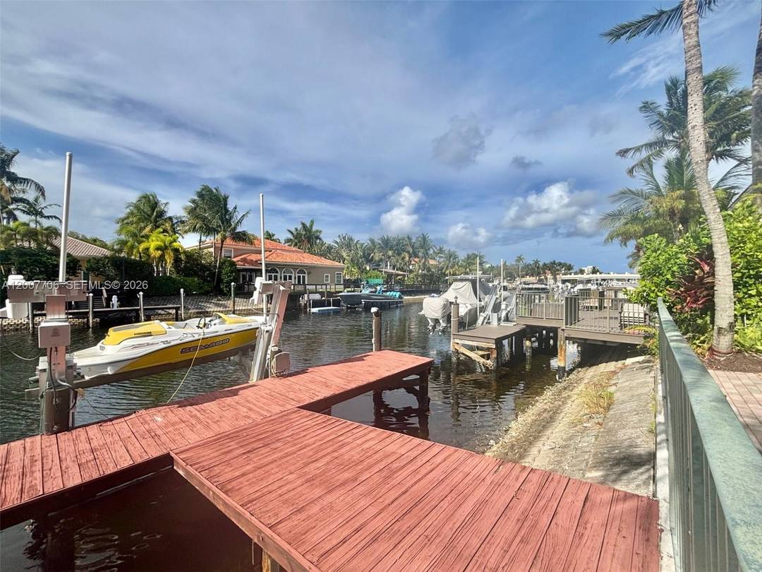 Welcome to a truly one of a kind coastal retreat this exceptional WATERFRONT 2 story estate, once owned by the legendary Joe DiMaggio, blends timeless prestige with modern luxury.