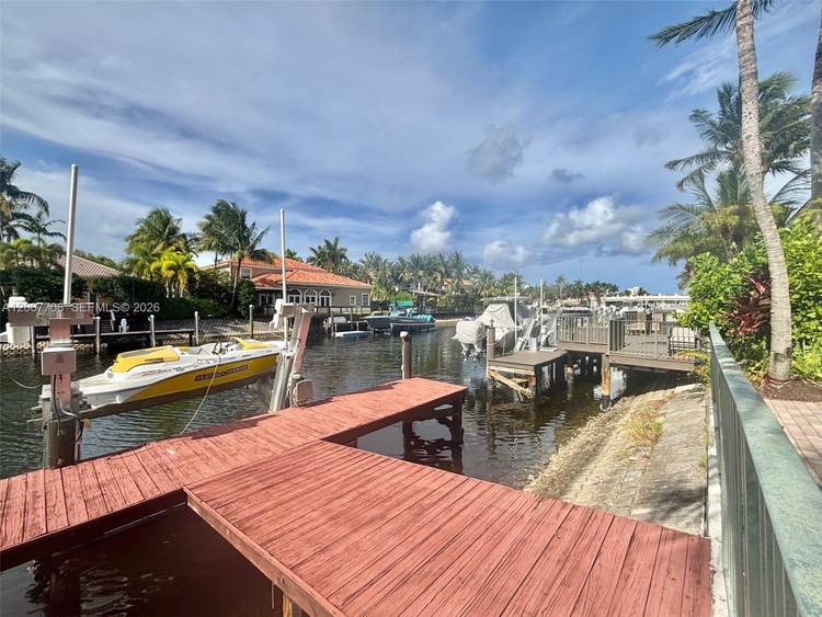Welcome to a truly one of a kind coastal retreat this exceptional WATERFRONT 2 story estate, once owned by the legendary Joe DiMaggio, blends timeless prestige with modern luxury.