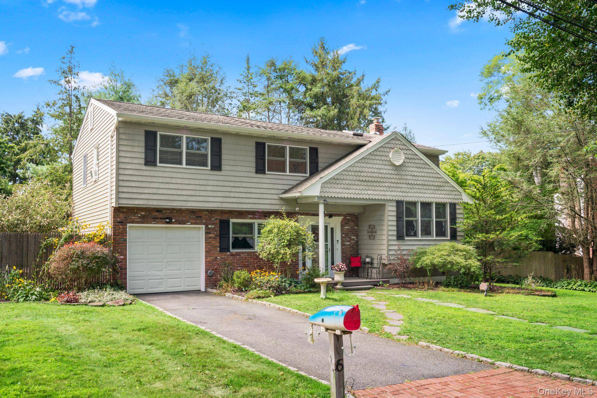 Welcome to this Beautifully Renovated Home, Perfectly Tucked Away on a Peaceful Cul de Sac North of 25A.
