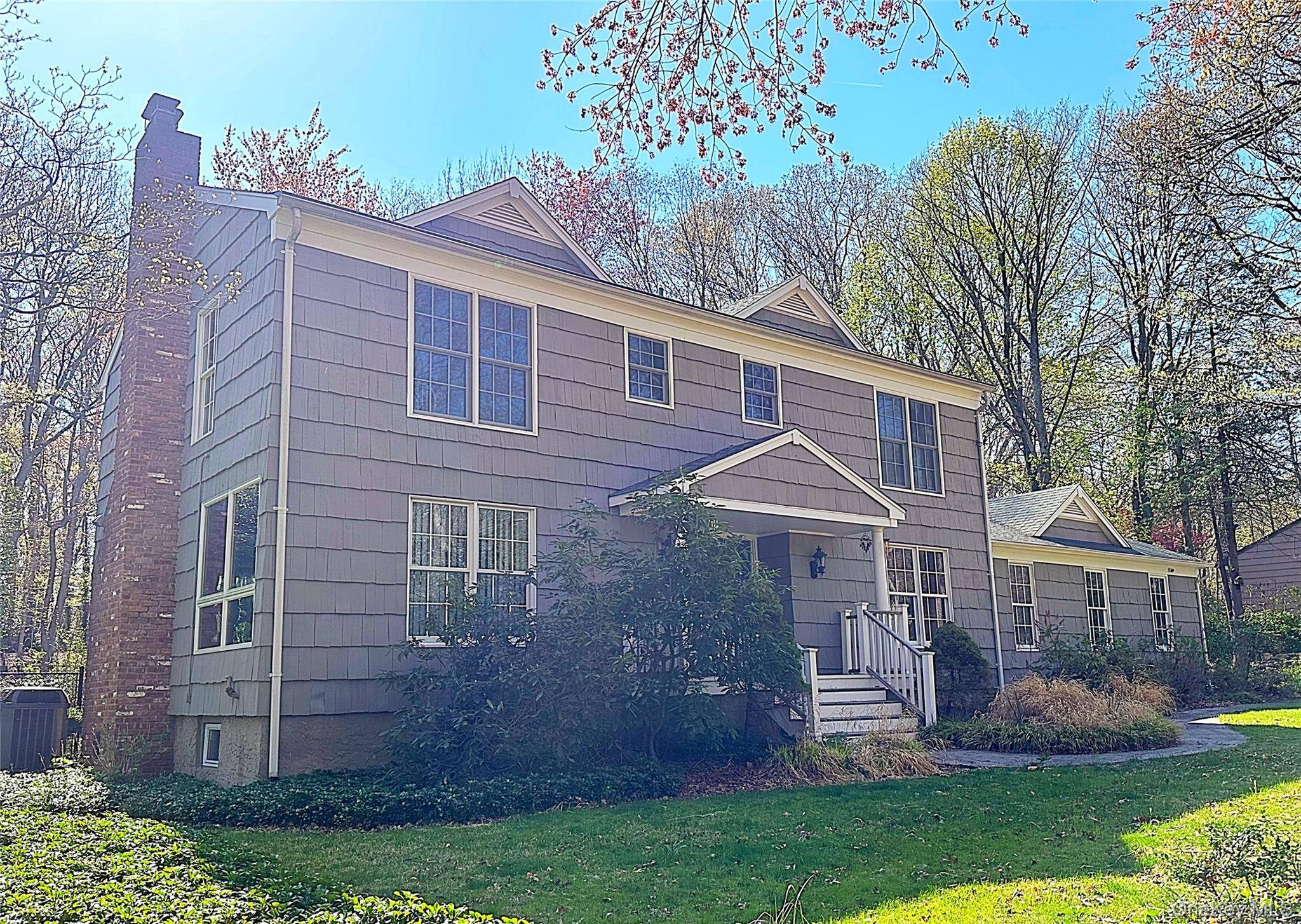 Beautiful colonial style home in Belle Terre community with close proximity to private North Shore LI Beach.