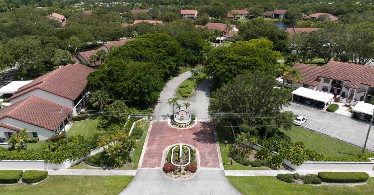 This updated two bedroom, two bathroom condo in Montego Cove, a 55 plus community, features a spacious courtyard patio and an enclosed porch with lake views.
