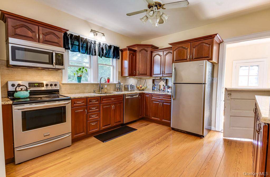 Beautifully updated home filled with natural light and hardwood floors throughout.