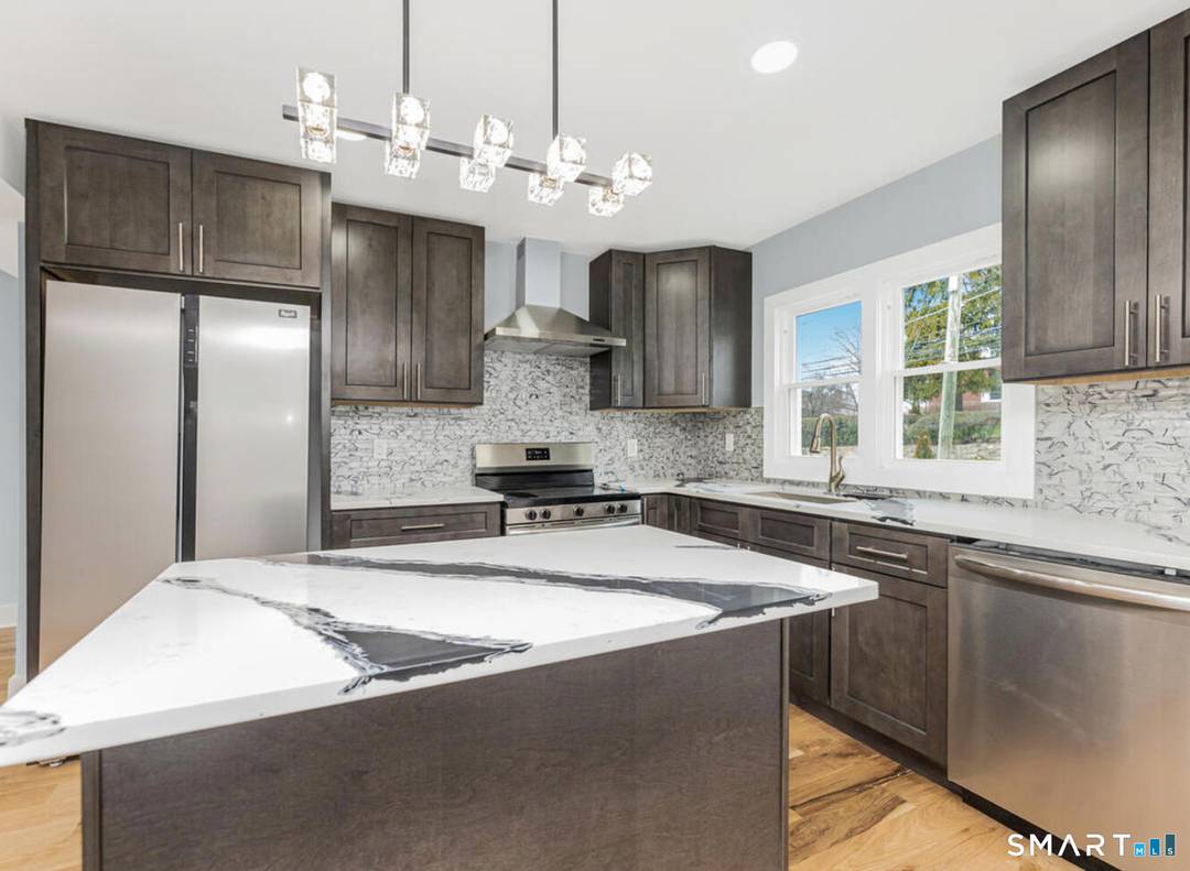 This beautifully reimagined 4 bedroom, 3 bath home in Stamford's sought after Glenbrook neighborhood blends timeless charm with modern living.