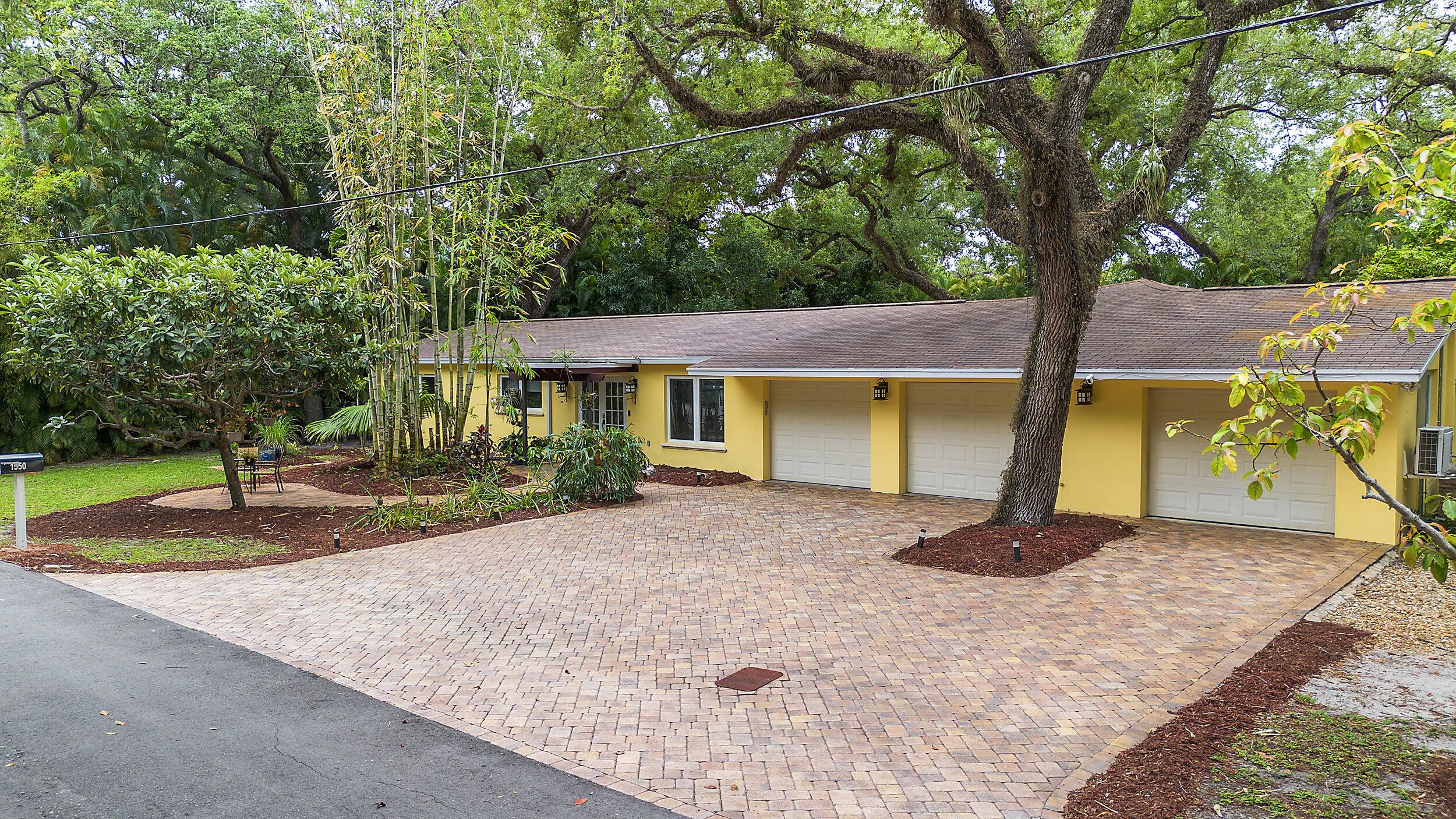 This home has many rare features, Completely renovated and nestled on just under 1 2 acre lot, 140'x140', shaded by 8 oak trees and enveloped by large palms, exotic bamboos.