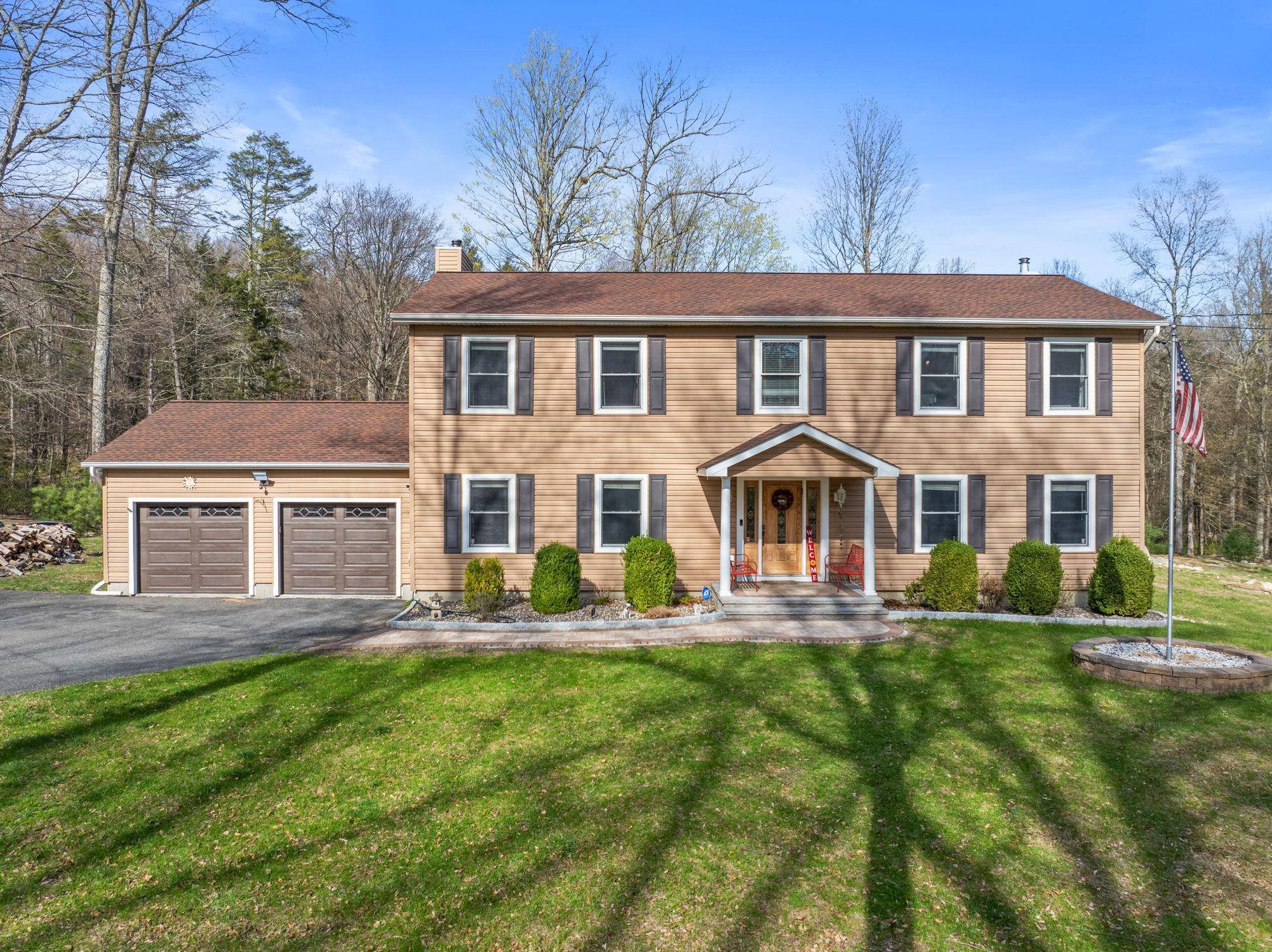 Welcome to this stunning colonial, gracefully nestled on nearly seven serene acres within the sought after Pine Bush School District.