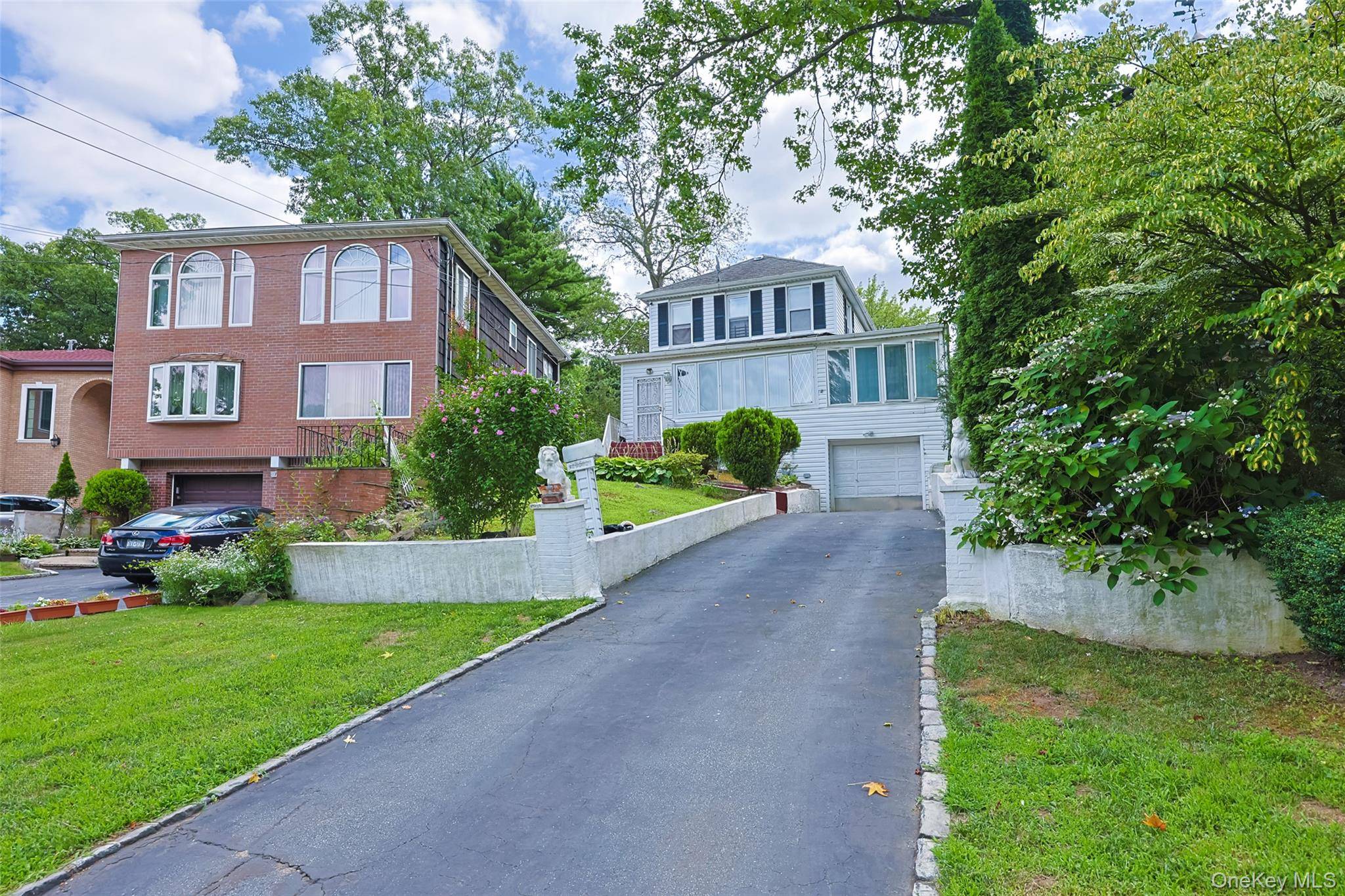 Welcome to 195 12 McLaughlin Avenue Holliswood, NY 11423, a rare find in one of Queens most coveted and elevated residential enclaves.