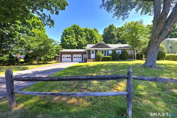Welcome home to this turn key cottage with a wonderful tiered back yard.