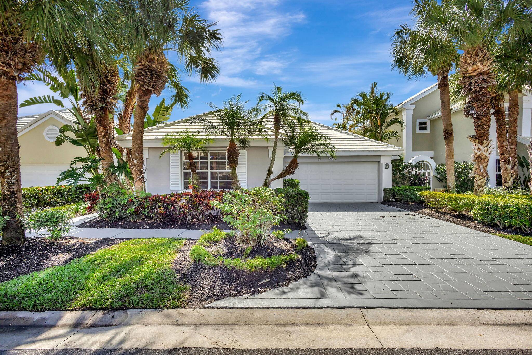 This stunning home is nestled on a serene lake in a highly desirable, manned gate community, offering both tranquility and convenience.