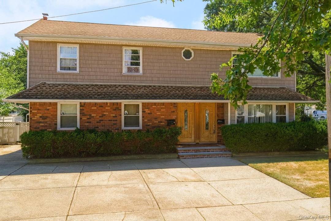 Welcome to 1551 Sweetman Avenue a rare duplex opportunity in the heart of Elmont !