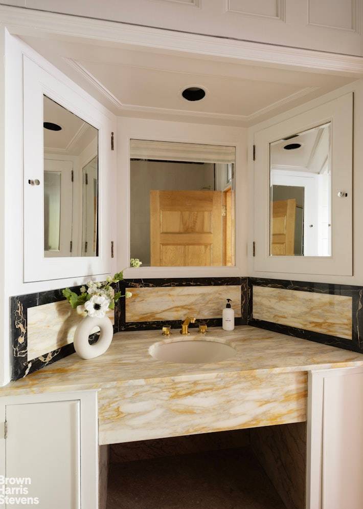 Built at the turn of the century by renowned architects Buchman and Deisler, this stately limestone townhouse sits on a historic landmark block between Madison and Park Avenues.